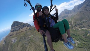 Tandem flight selfie with lion's head in the background